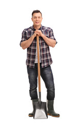 Poster - Young agricultural worker posing with a shovel