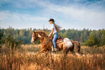 Wall Mural - Girl riding on the Appaloosa horse