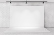 © doomu - White Backdrop Stage in Room with Brick Wall