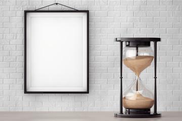 Vintage Sand hourglass in front of Brick Wall with Blank Frame