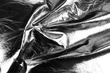 Black shiny leather texture close up