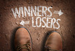 Top View of Boot on the trail with the text: Winners - Losers