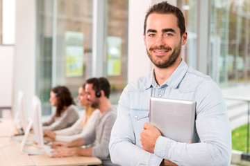 Portrait of a young attractive man at work