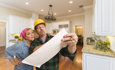 Wall Mural - Contractor Discussing Plans with Woman Inside Custom Kitchen Int