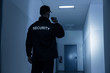 © Andrey Popov - Security Guard With Flashlight In Building Corridor
