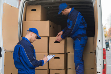 Delivery Men Unloading Boxes