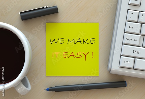 Fotografie, Obraz WE MAKE IT EASY!, message on note paper, computer and coffee on table