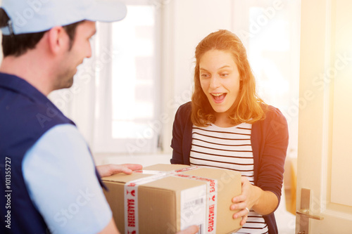 Fotografie, Obraz Delivery man handing over a parcel to customer