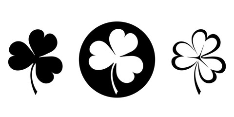 Set of three black silhouettes of clovers (shamrock). Vector illustration.