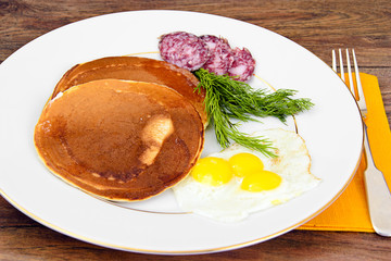 Pancakes with Quail Eggs, Cold Meats, Pastry Spoon with Black Ca