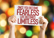 Once You Become Fearless Life Becomes Limitless placard with bokeh background