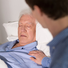 Canvas Print - Helpful grandson in hospital