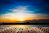 Fototapeta  - Wooden walkway on sunset background