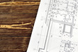 © georgimironi - Photo drawings for the project engineering work that lie on background a wooden table