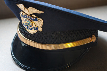 Closeup of a blue municipal Police Chief hat.  Alaska.