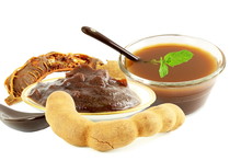 Tamarind With Tamarind Water Concentrate Chutney Pulp Or Paste On White Background