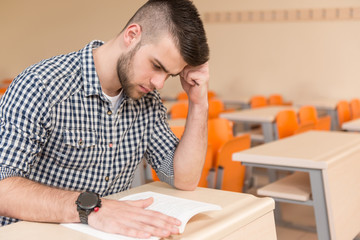 Wall Mural - Student With Books Sitting In Classroom