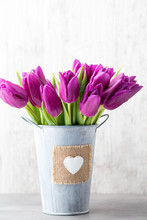 Purple Tulip Bouquet On The Gray Background.
