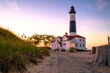 The Big Sable Lighthouse illuminated by the golden rays of the setting sun. Ludington State Park. Ludington, Michigan. The lighthouse is only accessible by foot after a mile and a half hike.