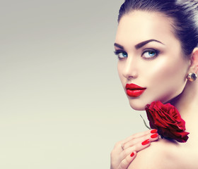 Poster - Beauty fashion model woman face. Portrait with red rose flower