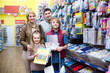 © JackF - Family choosing stationery in store.