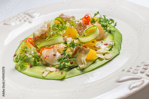 Fotografia, Obraz Carpaccio of prawns with citrus sauce on a white background