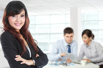 Poster - Young asian businesswoman standing with her secretary behind