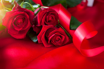 Sticker - Valentine's Day red roses bouquet over silk background