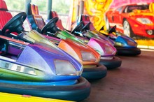 Colorful Electric Bumper Car In Autodrom In The Fairground Attractions At Amusement Park. Selective Focus On The Cars