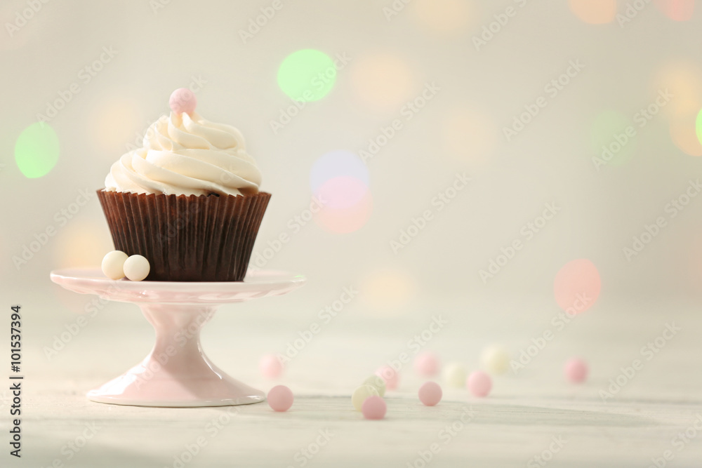 Chocolate cupcake on blurred background