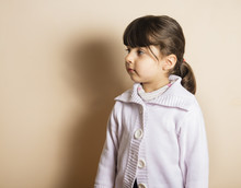 Small Girl In Studio With Off White Background