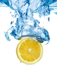 Canvas Print - lemon dropped in a water above white background