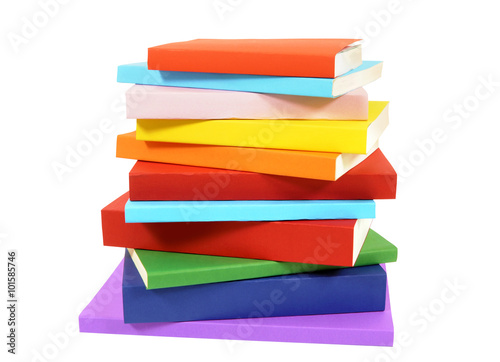 Fotografia, Obraz Closeup untidy small pile of paperback books isolated on white background