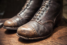 Old Used Boots Made Of Genuine Leather, Close Up Photo