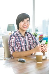 Poster - Smiling hipster businessman using smartphone 