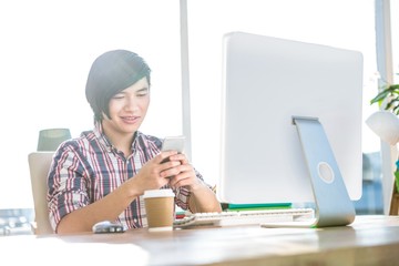 Poster - Smiling hipster businessman using smartphone 