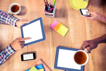 Poster - Cropped image of business people using technologies