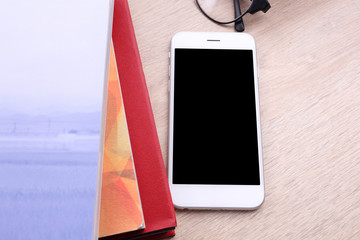 Poster - smartphone and book on wooden background