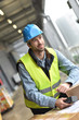 © goodluz - Portrait of warehouseman scanning merchandise on dock