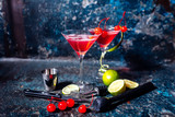 Fototapeta  - cosmopolitan cherry martini cocktail, served cold with lime and ice