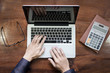 © snowing12 - Top view of business man hands working on laptop or tablet pc on