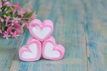 Wall Mural - Valentine candies on color wood.selective focus.