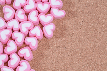 Wall Mural - heart shaped candies on background,selective focus.