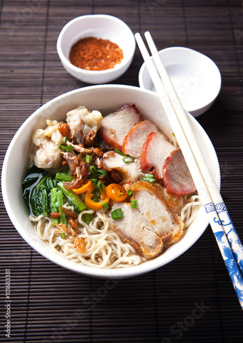 Photo  noodle with crispy pork and sliced fried pork,thai food