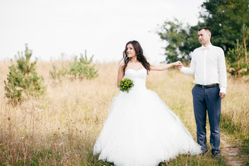 Wedding shot of bride and groom in park