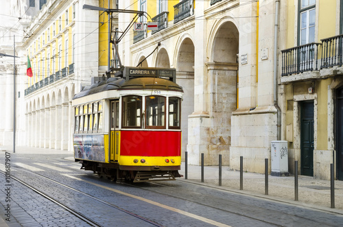 Naklejka na szybę Romantic Lisbon street with the typical yellow tram