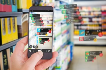 Poster - composite image of female hand holding a smartphone