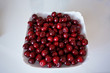 Delicious red cherries in white plate sweet and yummy