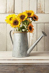 Fotomurales - Bouquet of sunflowers in silver watering can