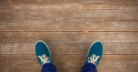 Poster - Composite image of man with canvas shoes on hardwood floor